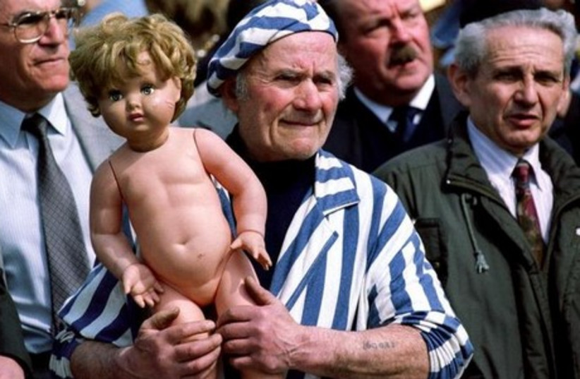 A Holocaust survivor attends a memorial in France. (photo credit: REUTERS)