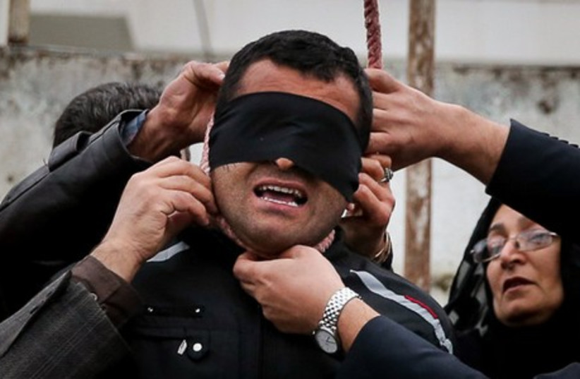 24-year-old Iranian just as he was about to be executed (photo credit: IRANIAN MEDIA)
