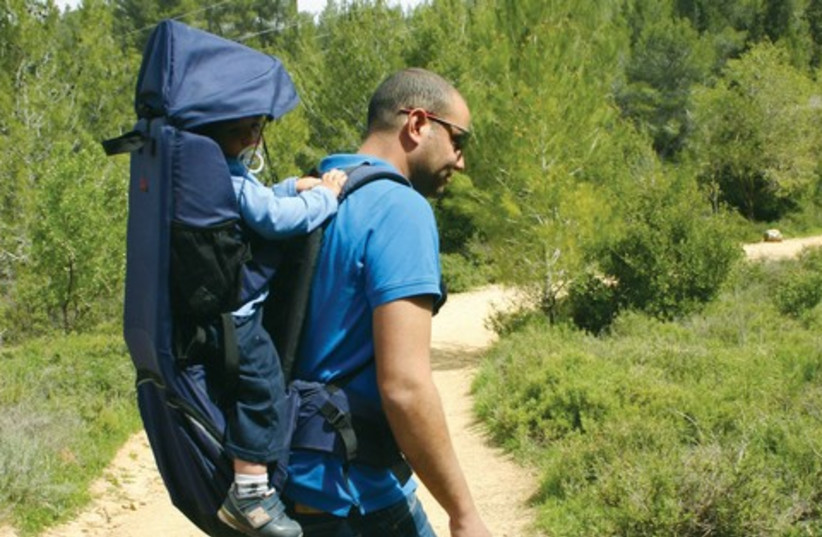 Etay Ziv, hiking with one of his children. (photo credit: Courtesy)