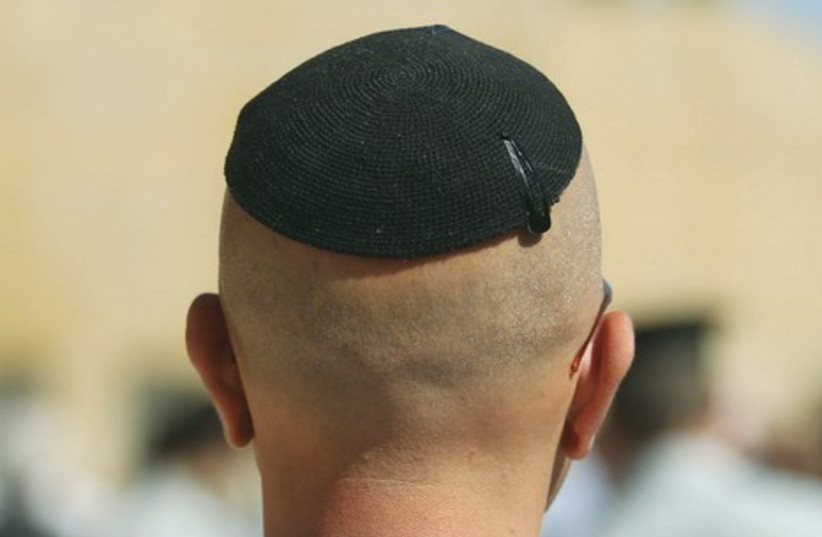 Does wearing a large kippa most of the day prevent the scalp from breathing and possibly lead to hair loss? (photo credit: MARC ISRAEL SELLEM)