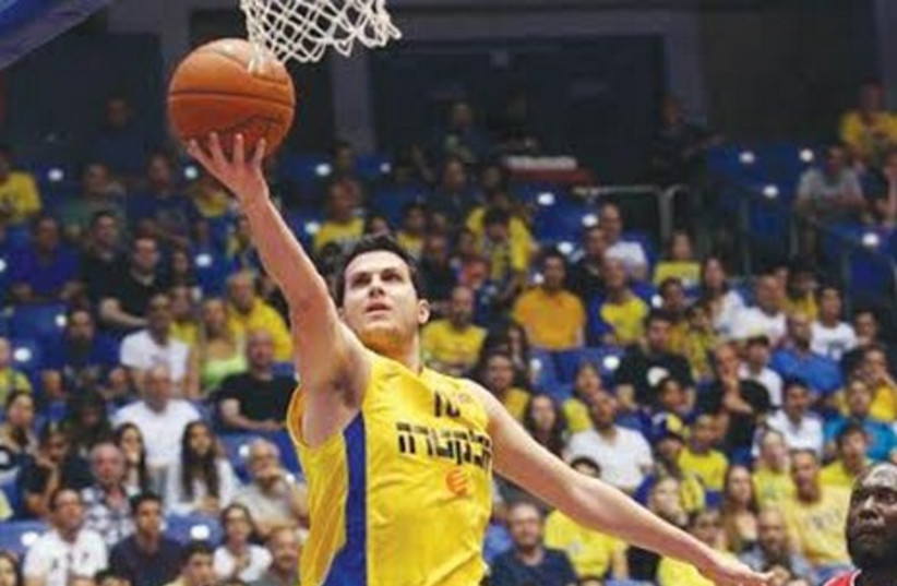  Maccabi Tel Aviv guard Guy Pnini scored 14 points in his team’s 93-67 win over Hapoel Gilboa/Galil at Nokia Arena Saturday night. (photo credit: ODED KREMER/BSL)