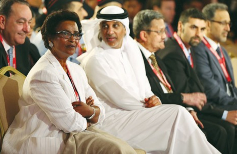 Sheikha Naima Al-Ahmad Al-Jaber Al-Sabah (left), president of the Kuwait Women’s Sports Federation, and Sheikh Hamad bin Khalifa Al Thani (second left), president of Qatar’s Football Association, attend the opening ceremony of the Soccerex Asian Forum conference at the King Hussein Convention Center (photo credit: REUTERS)
