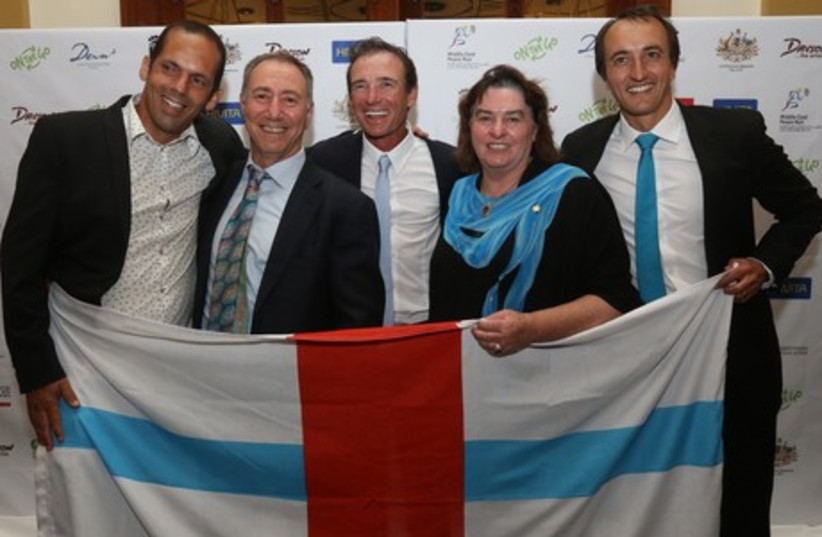 AUSTRALIAN ULTRA-MARATHONER Pat Farmer, center, is joined (from left) by Dror Ben Ami, Danny Hakim, Sharon Davson, and Australian Ambassador Dave Sharma at a reception at the King David Hotel Monday night honoring his symbolic trek across the Middle East. (photo credit: RONEN TOPELBERG)