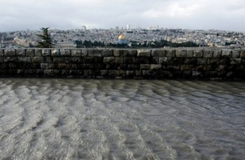Rain water creates floods and puddles in Jerusalem (photo credit: REUTERS)