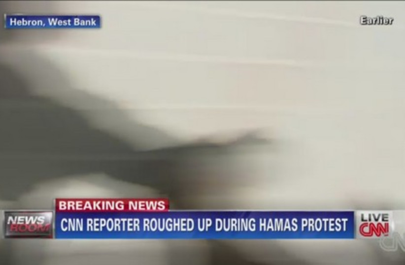 CNN's footage of its reporter being assaulted by Palestinian Authority policemen. (photo credit: COURTESY CNN)