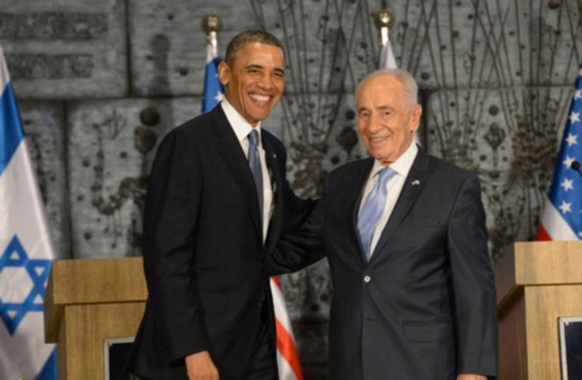 President Shimon Peres meets with US President Barack Obama, March 20, 2013.  (photo credit: AMOS BEN-GERSHOM/GPO)