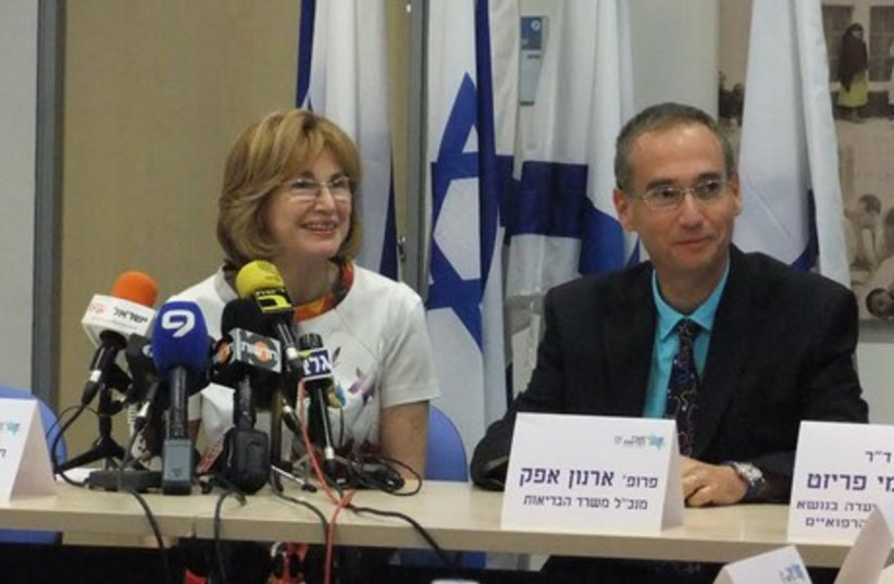 Health Minister Yael German and Prof. Arnon Afek, the ministry’s director-general, present the German Committee to Strengthen the Public Health System report in Jerusalem, June 25, 2014. (photo credit: JUDY SIEGEL-ITZKOVICH)