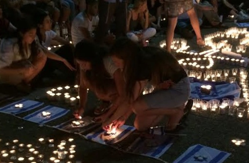 Candlelight vigil for murdered teens, Tel Aviv, June 30, 2014. (photo credit: Lahav Harkov)