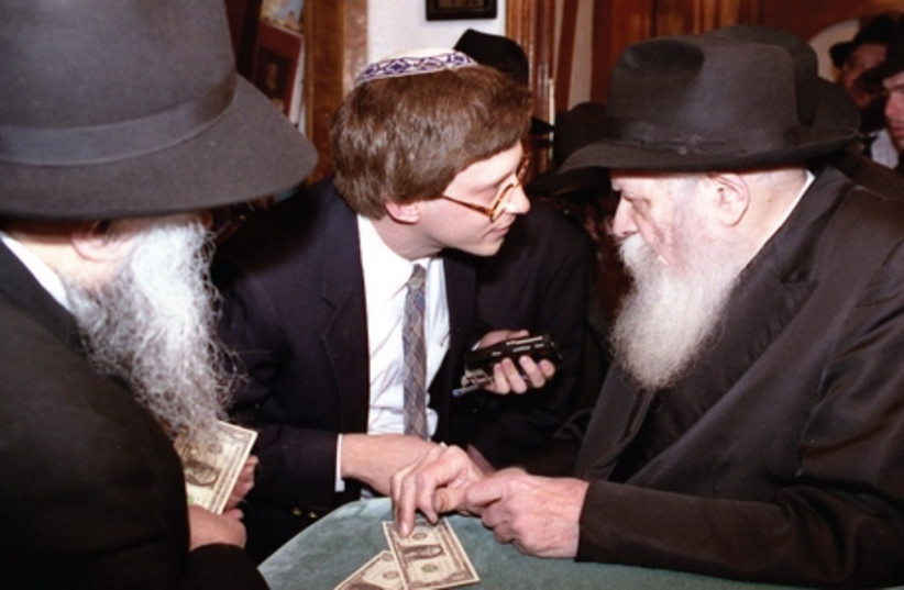 The author with the Lubavitcher Rebbe in 1992. (photo credit: REUTERS)