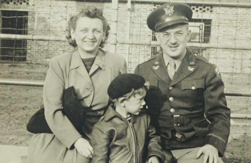A young David Geffen (center) poses with his mother and father at a military base in Mississippi. (photo credit: AVIE GEFFEN PICTORIAL ARCHIVES)