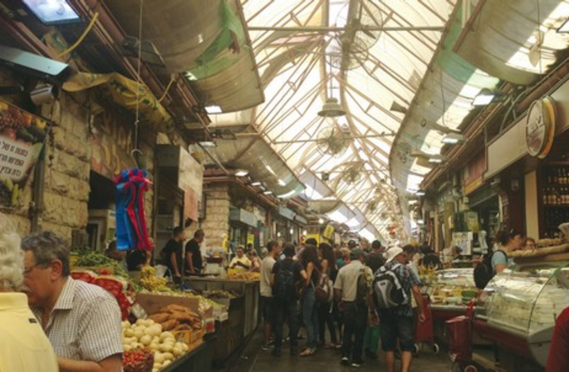 Yalla Basta market bites offers an audio smartphone, and directs users to a variety of recommended stands and stalls (photo credit: MEITAL SHARABI)