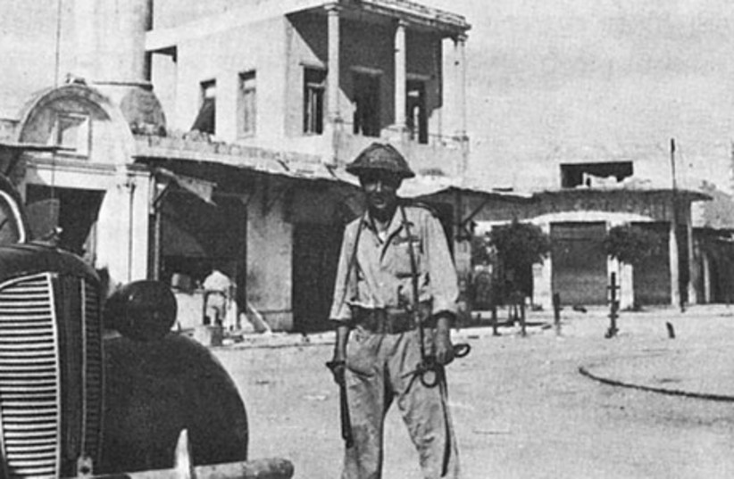  An Israeli soldier in central Lydda in July 1948 (photo credit: Wikimedia Commons)