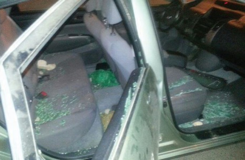 A car with its windows smashed, provides grim evidence of the Beduin violence that rocked the Negev town of Omer on Sunday night. (photo credit: NISSIM NIR / OMER MUNICIPALITY)