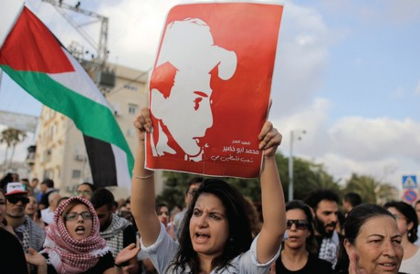 Israeli arabs take part in a protest in Acre earlier this week. (photo credit: AMMAR AWAD / REUTERS)