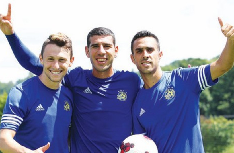 Maccabi Tel Aviv players (including Rade Prica, center) have turned their full focus to Tuesday’s Champions League second qualifying round first leg at Santa Coloma of Andorra after arriving in Barcelona yesterday. (photo credit: MACCABI TEL AVIV WEBSITE)