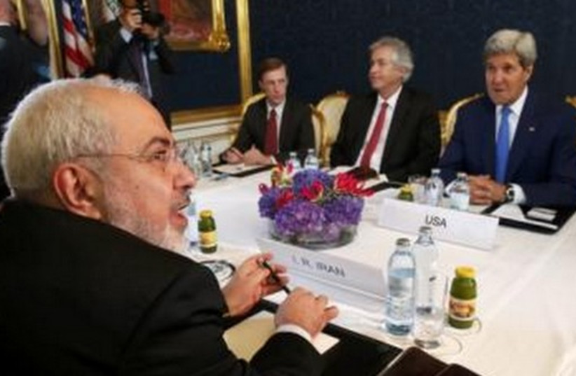 Iran's FM Javad Zarif (L) holds a bilateral meeting with US Secretary of State John Kerry (R) in talks over Tehran's nuclear program in Vienna, July 14, 2014. (photo credit: REUTERS)