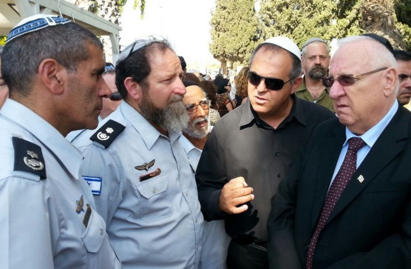 Rivlin at the funeral of Dror Hanin, Yahud. (photo credit: ASSAF ABRAS)
