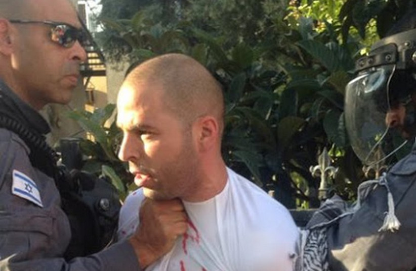Police in Haifa arrest a pro-Palestinian demonstrator. (photo credit: Courtesy)