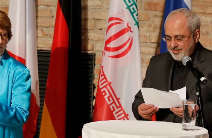 EU foreign policy chief Ashton and Iranian Foreign Minister Mohammad Zarif attend a news conference in Vienna (photo credit: REUTERS)