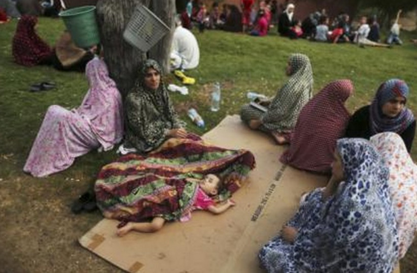 Palestinian women in Gaza who fled their homes (photo credit: REUTERS)