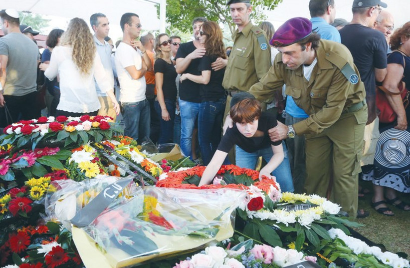 ORI GREENBERG, 13, mourns at the grave of his father, Maj. Amotz Greenberg, at his funeral  (photo credit: MARC ISRAEL SELLEM)