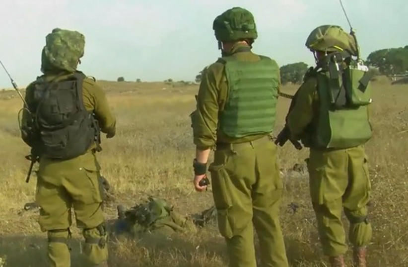 IDF soldiers at the scene of a twarted attempt by terrorist to infiltrate into Israel, July 21, 2014. (photo credit: IDF SPOKESMAN'S OFFICE)