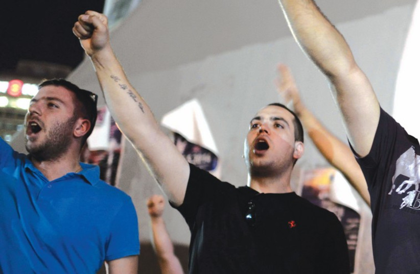 Right-wing activists protest in Tel Aviv on July 1. (photo credit: TOMER NEUBERG/FLASH 90)