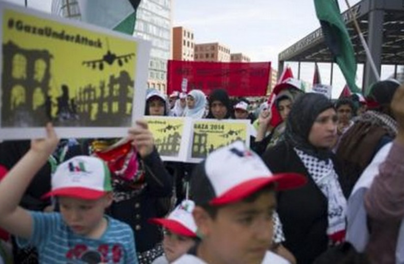 Women and children attend a demonstration supporting the Palestinians, in Berlin July 22, 2014. (photo credit: REUTERS)