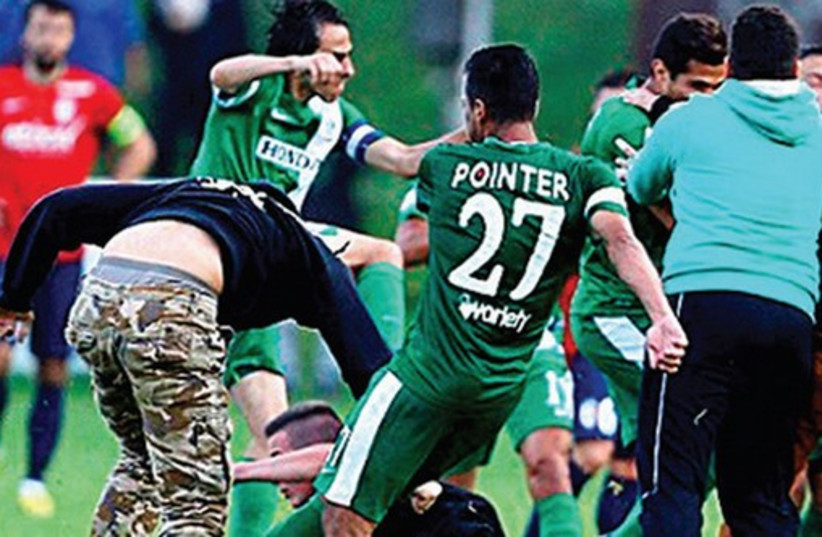 Maccabi Haifa teammates were forced to fight for their safety after being attacked by a mob of pro-Palestinian protesters Wednesday in Austria. (photo credit: MACCABI HAIFA WEBSITE)