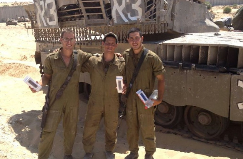 Soldiers with battery packs. (photo credit: Courtesy)
