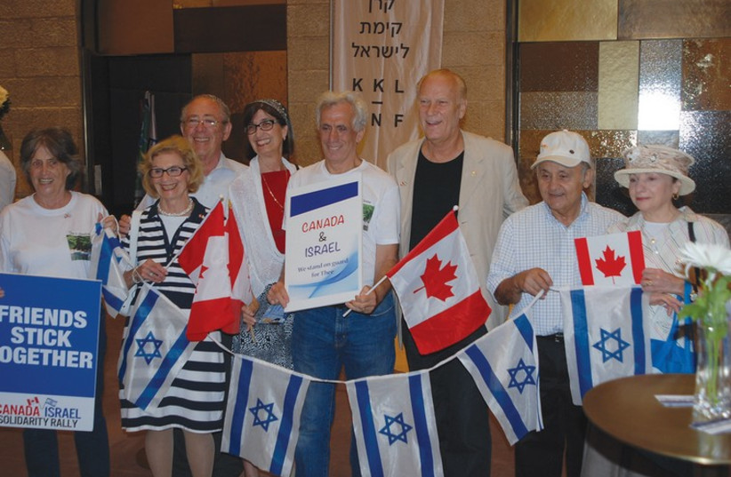 CANADIANS HOLD an Israel solidarity rally at the David Citadel Hotel in Jerusalem on Wednesday night (photo credit: MICHAEL FRIEDSON/THE MEDIA LINE)