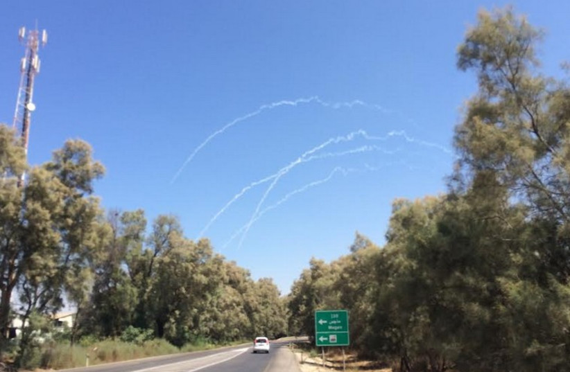 Tracks from artillery fire seen in sky above Gaza border (photo credit: SAM SOKOL)