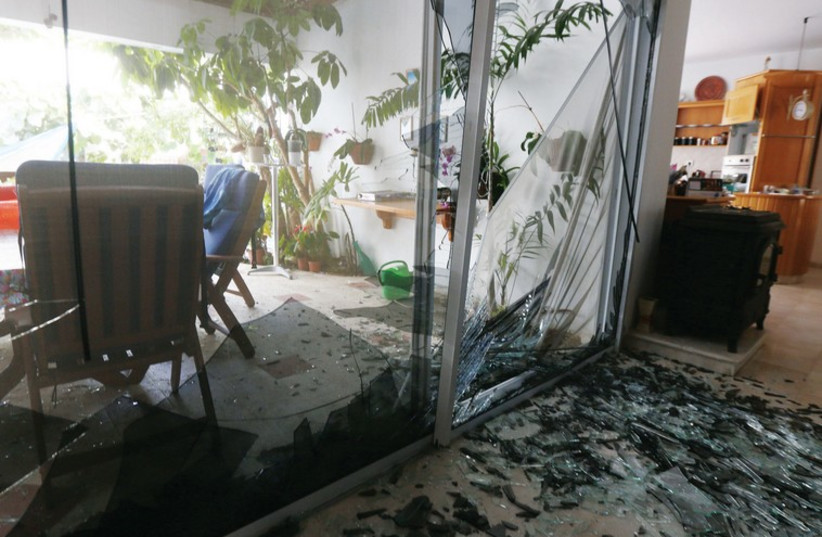 A house hit by a rocket in Ashkelon. (photo credit: MARC ISRAEL SELLEM/THE JERUSALEM POST)