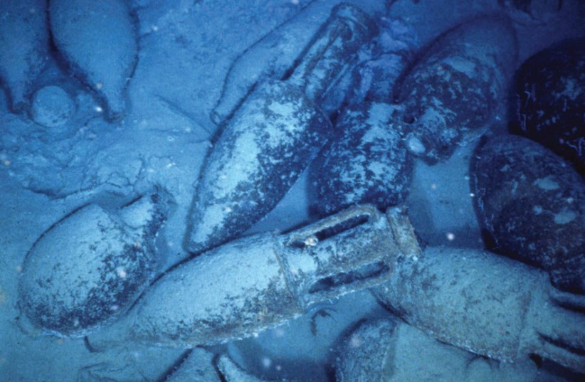 AMPHORAS, VESSELS for carrying wine, are seen at an underwater archaeology dig off Italy. (photo credit: REUTERS)