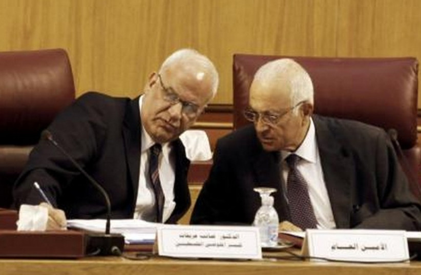  Palestinian chief negotiator Saeb Erekat (L) talks with Arab League Chief Nabil el-Araby during their meeting at the Arab League in Cairo August 11, 2014. (photo credit: REUTERS)