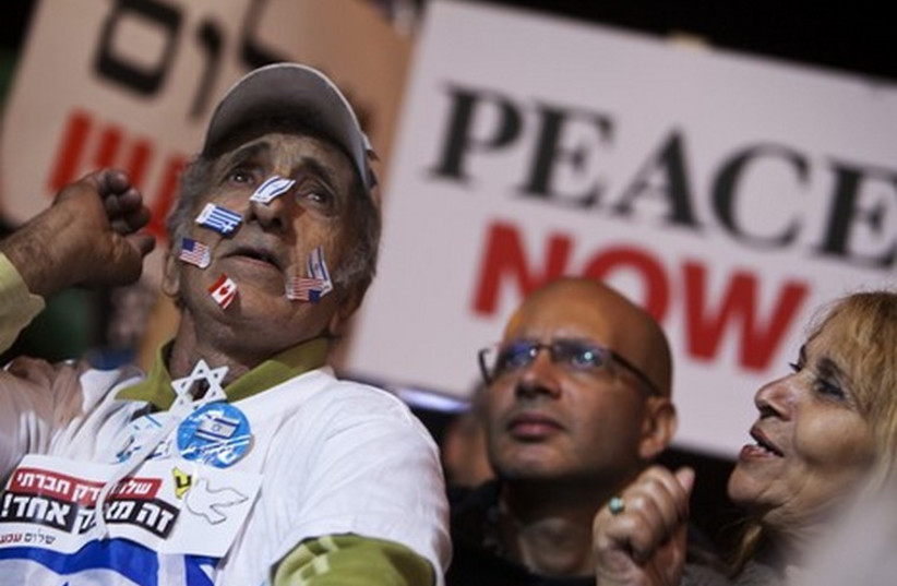 Israelis attend a pro-peace rally in Tel Aviv. (photo credit: REUTERS)