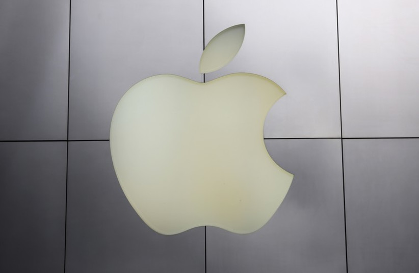 The Apple logo is pictured at its flagship retail store  (photo credit: REUTERS)