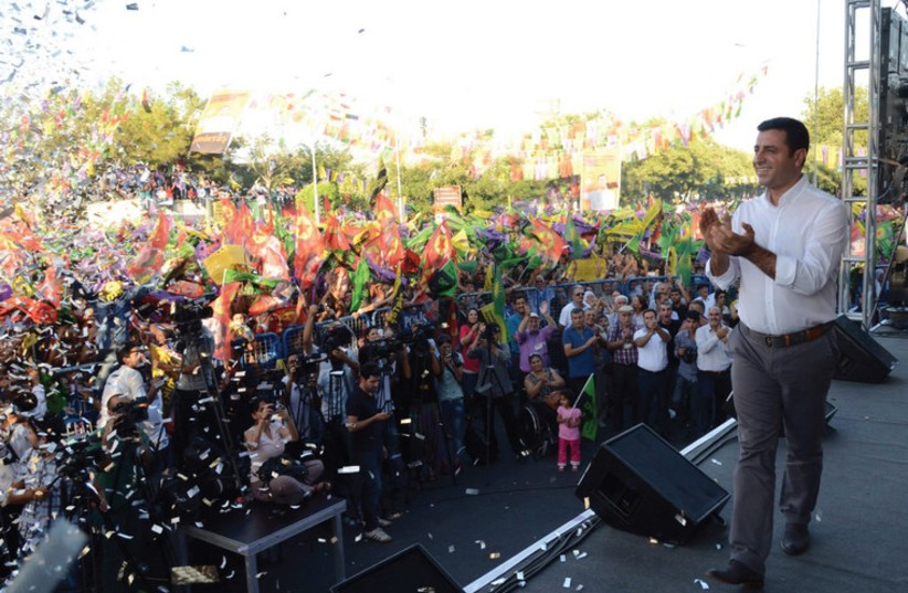 Presidential candidate SELAHATTIN DEMIRTAS speaks during an election rally in Diyarbakir, days before he lost the Turkish election  (photo credit: REUTERS)