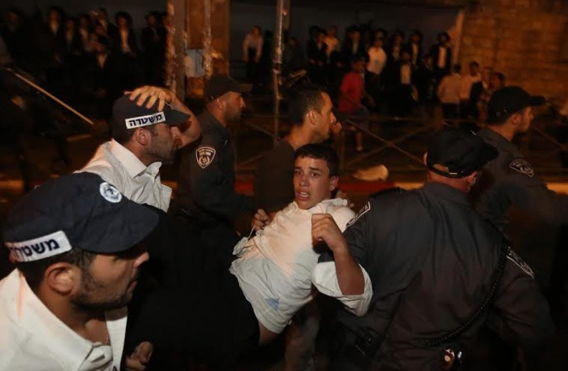 Haredi protester arrested, Jerusalem, August 17, 2014 (photo credit: MARC ISRAEL SELLEM)