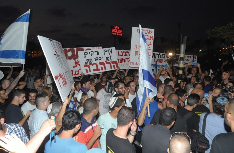Protest against Arab man and a Jewish-born woman (photo credit: AVSHALOM SASSONI)