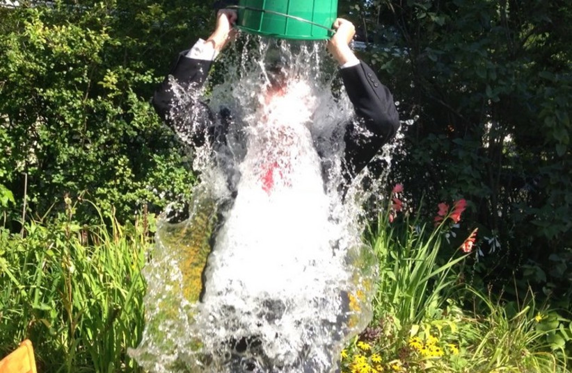 Yesh Atid MK Dov Lipman taking the ALS ice bucket challenge. (photo credit: Courtesy)
