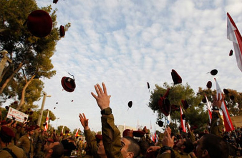 IDF paratroopers throw their berets in the air in happiness. (photo credit: REUTERS)