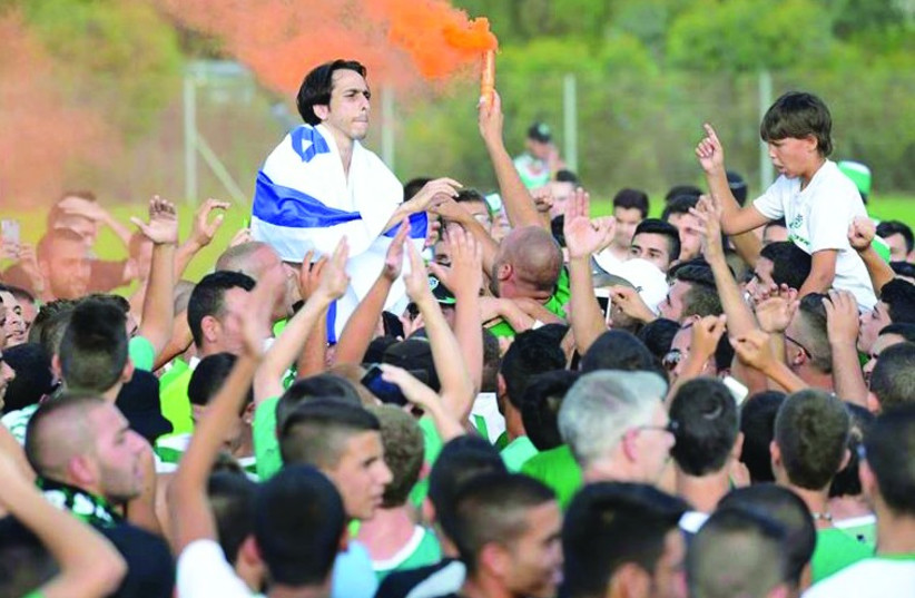 Yossi Benayoun will play his first Premier League match for Maccabi Haifa since 2002 next Monday and the Greens’ fans are thrilled. (photo credit: MACCABI HAIFA FACEBOOK PAGE)