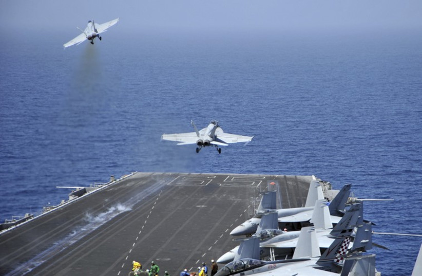 F/A-18F Super Hornets  launch from the aircraft carrier USS Enterprise (photo credit: REUTERS)