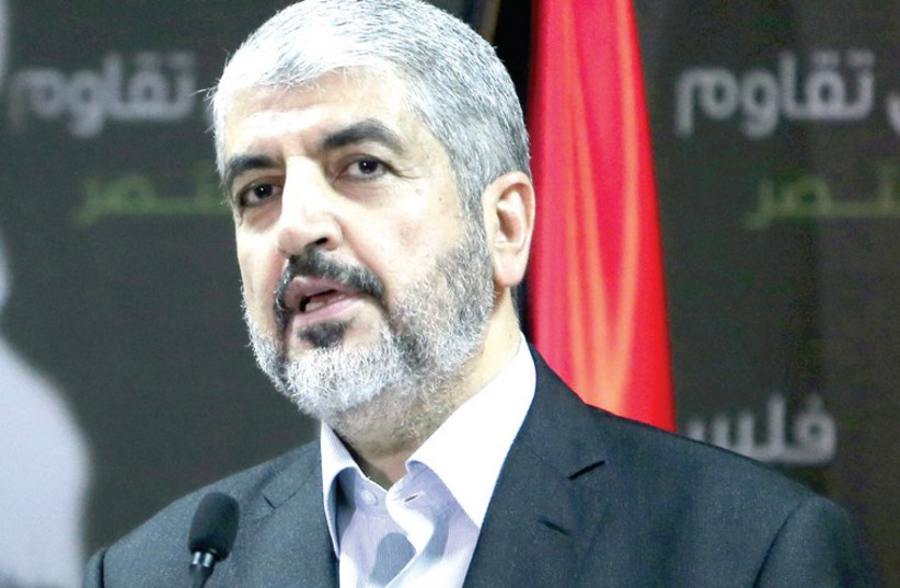 Hamas chief Khaled Mashaal holds a press conference in the Qatari capital Doha on July 23, rejecting a cease-fire in the Gaza battles. (photo credit: AFP)