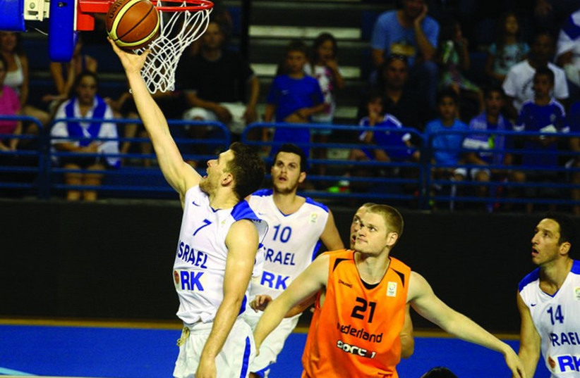 Israel's Gal Mekel scores two points in the EuroBasket competition. (photo credit: ISRAEL BASKETBALL ASSOCIATION)