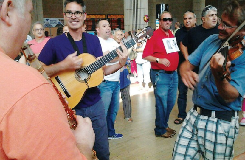 KIezmer musicians from around the world perform at Ben-Gurion Airport on Sunday. (photo credit: Courtesy)