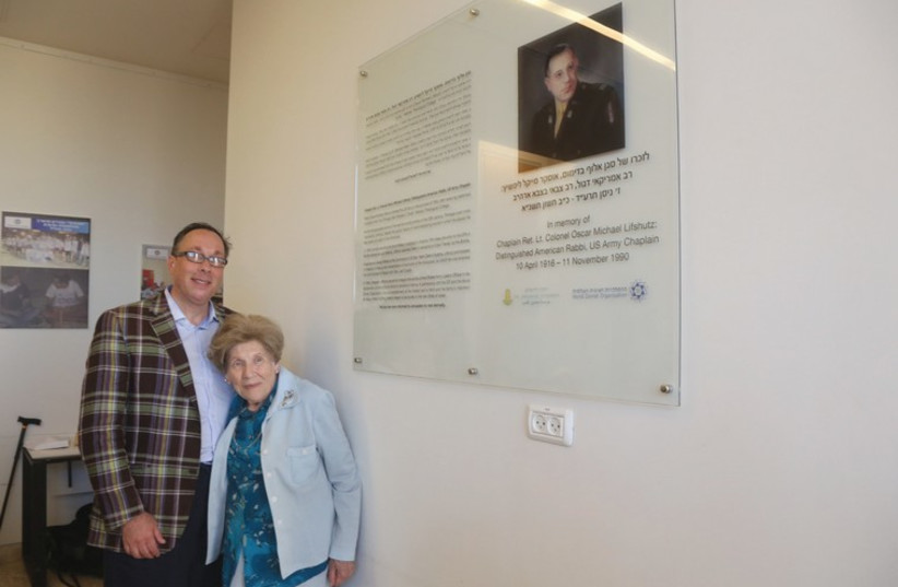 Participating in the dedication of the portrait plaque (right) in memory of Chaplain Oscar M. Lifshutz at the Herzl Center Educational Building on Tuesday evening are his son, Ira, and his sister-in-law, Shoshana Dolgin-Beer of Jerusalem. (photo credit: MARC ISRAEL SELLEM/THE JERUSALEM POST)
