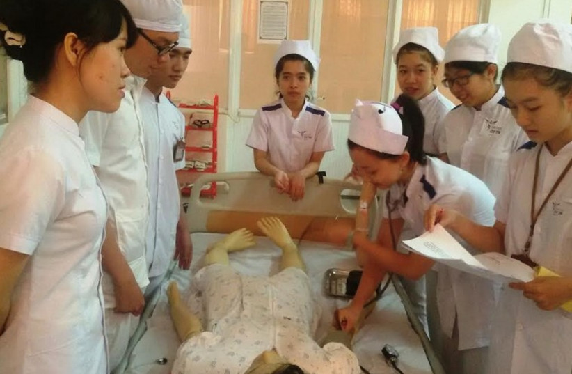 Visiting nursing students from Vietnam undergo instruction at Ben-Gurion University. (photo credit: Courtesy)