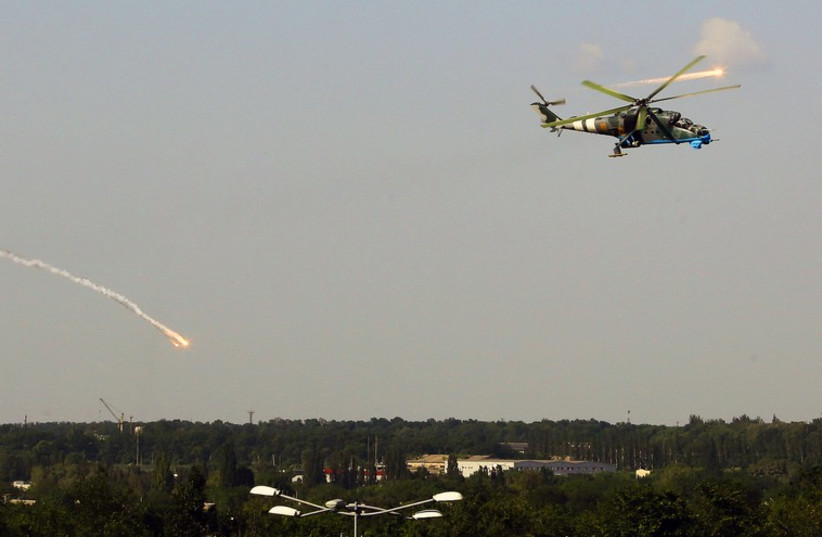 A Ukrainian helicopter flies over Donetsk (photo credit: REUTERS)